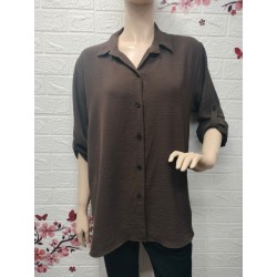 Camisa con botones detalle...