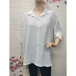 Camisa con botones detalle...