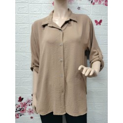 Camisa con botones detalle...
