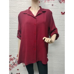 Camisa con botones detalle...